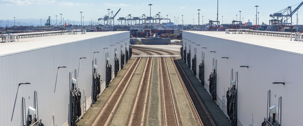 railroad tracks outside of a cold storage warehouse