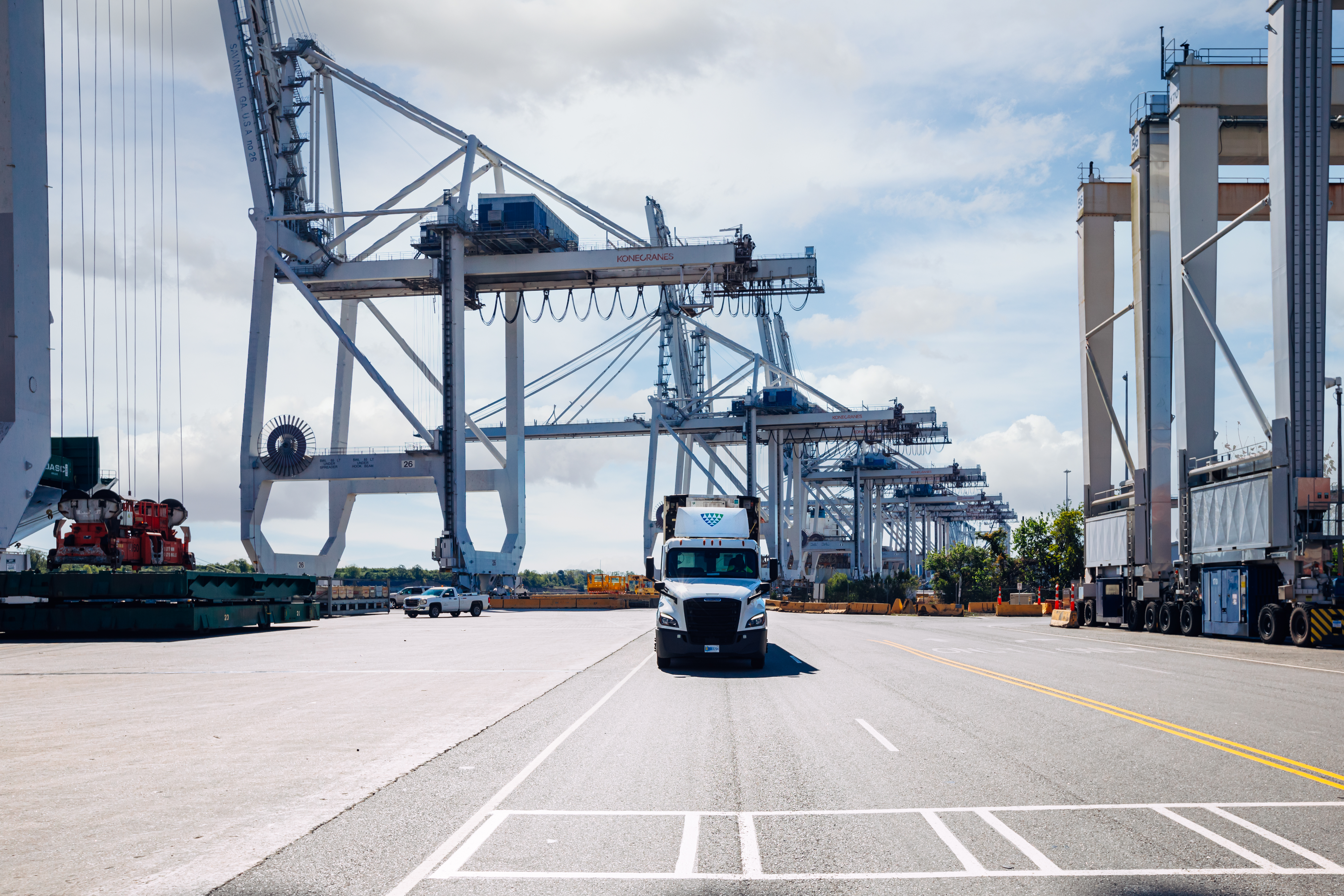 Lineage truck at port driving toward the camera