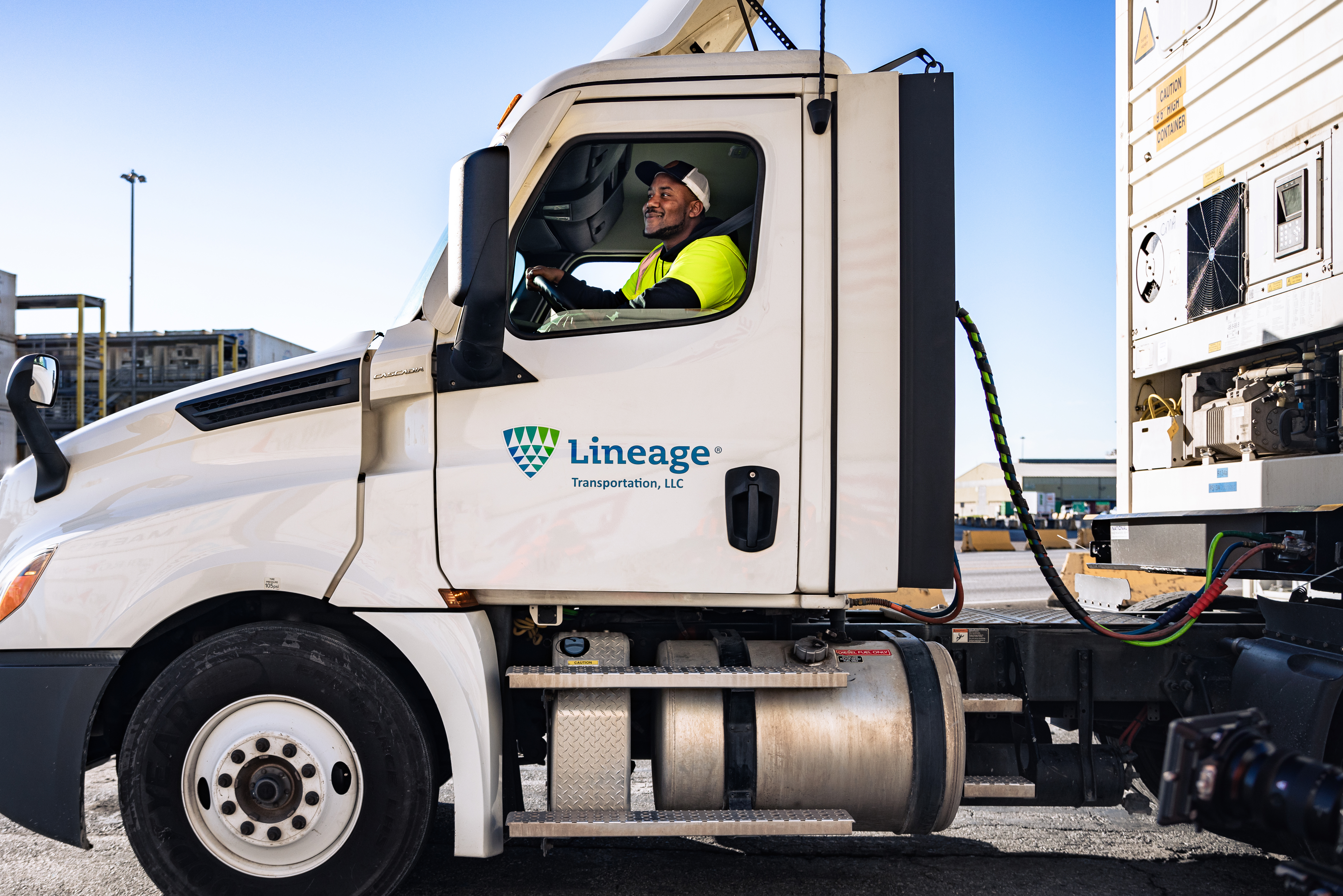 Happy man driving a Lineage truck