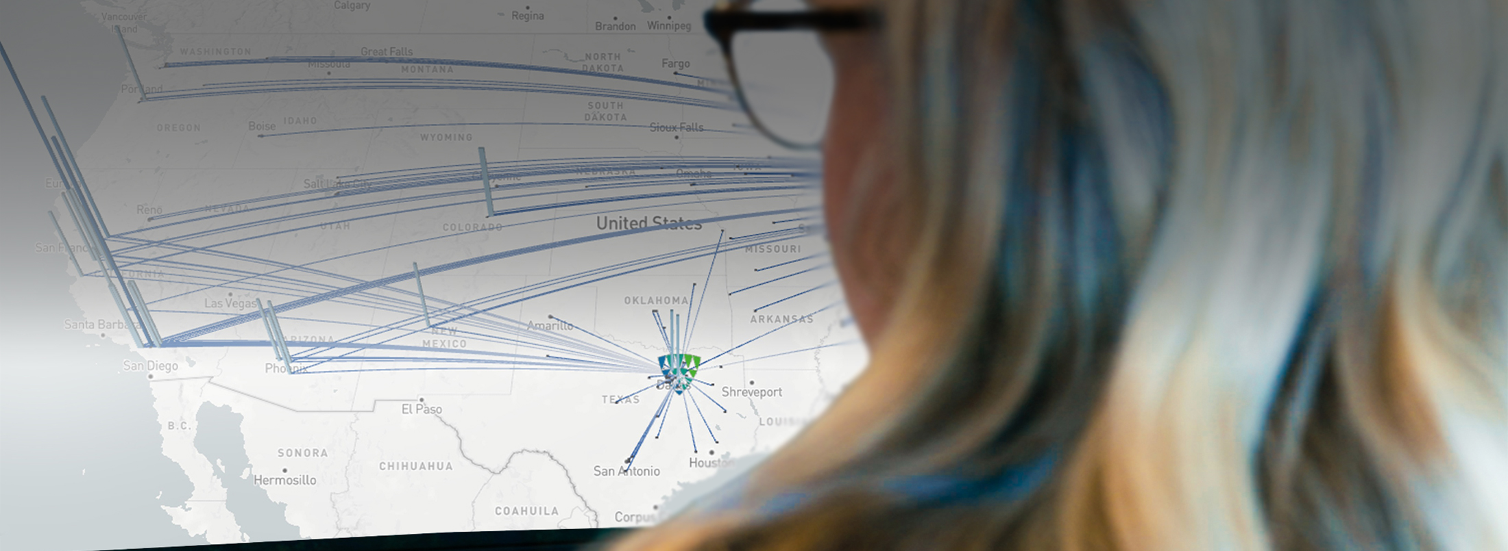 Lineage data scientist reviewing a U.S. supply chain network map with transportation routes visualized for optimization analysis.