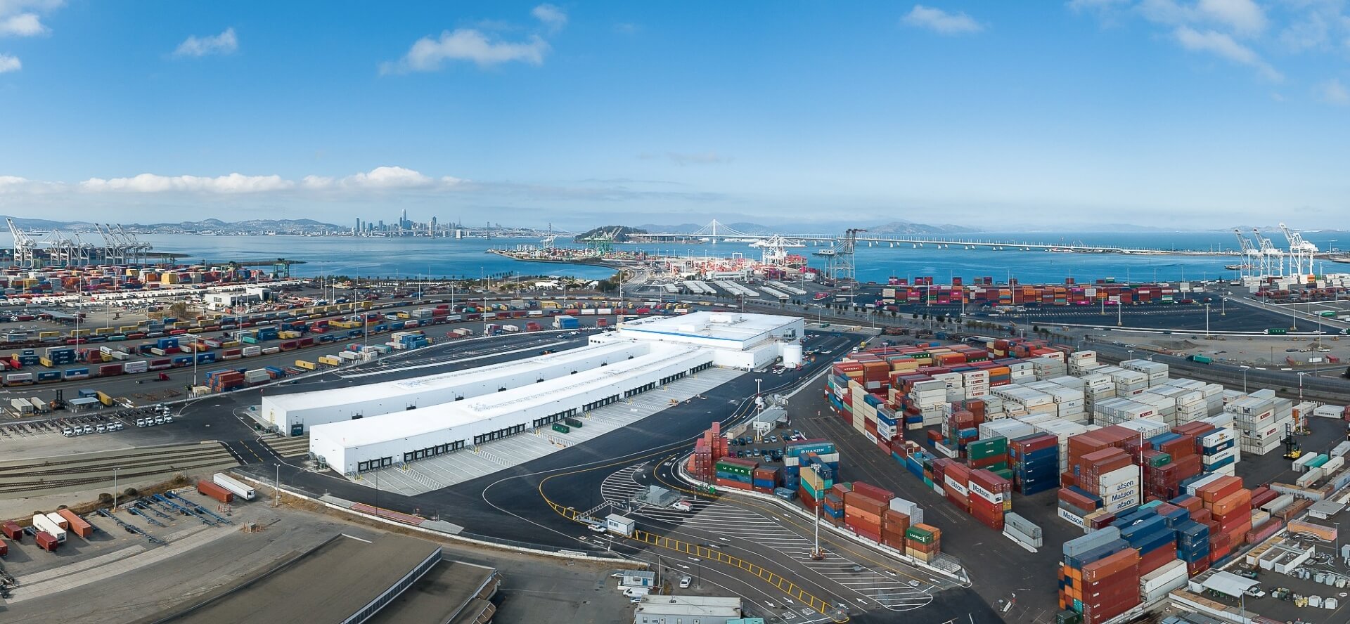Aerial view of Lineage’s cold storage facility at the Port of Oakland surrounded by shipping containers, representing bonded warehousing, imports and exports amid tariff trade routes.