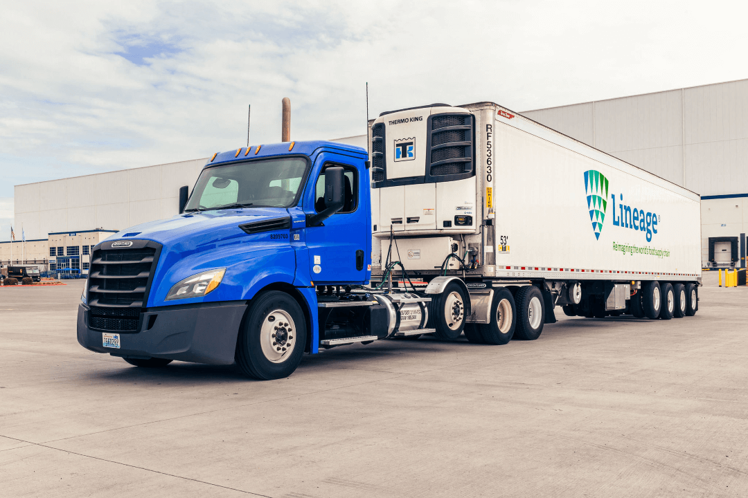 Lineage refrigerated truck and trailer parked at a temperature-controlled warehouse facility.