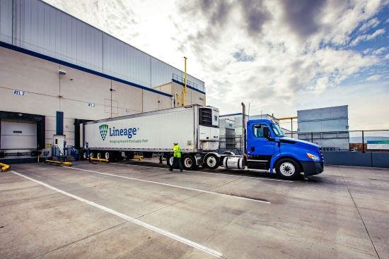 Lineage refrigerated truck stationed at a Lineage cold storage warehousing dock, loading up with food products to distribute to customers across the United States.