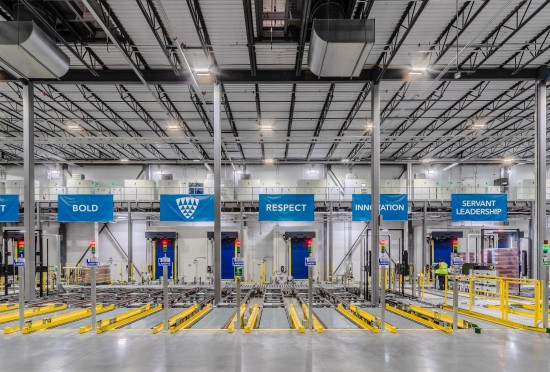 Automated cold storage operations inside a Lineage facility in Sunnyvale, Texas, with conveyor systems and warehouse equipment.
