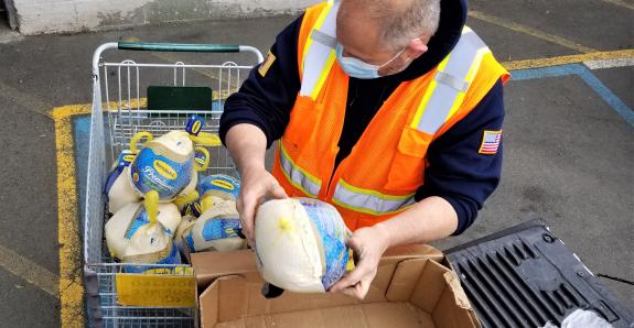 lineage team member unloading donated food