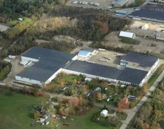 Exterior view of Ingersoll cold storage warehouse with Lineage logo