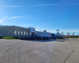 Exterior of Lineage London cold storage facility with loading docks and trucks