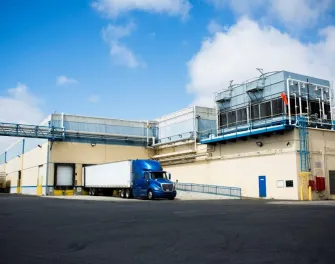 Exterior view of Lineage’s Oxnard, California cold storage warehouse with company logo