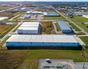 Exterior of Lineage’s Woodstock - Parkinson, Ontario cold storage facility with logo