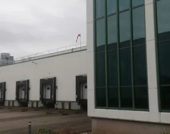 Lineage cold storage warehouse in Venlo, Netherlands with IQF freezing, case picking and backup power generator for product protection.
