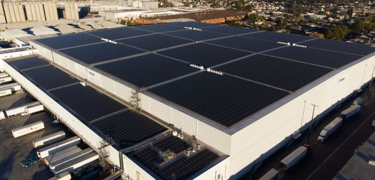Wide-angle shot of Lineage’s Los Palos facility with loading docks and trailers on-site
