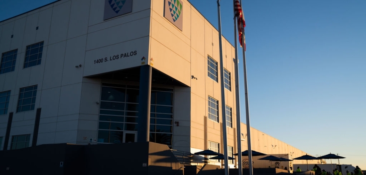 Front entrance of the Los Palos warehouse, highlighting signage and main access points