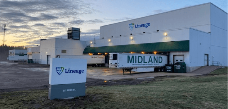 Lineage's Moncton cold storage facility at 123 Price Street, New Brunswick, featuring the company’s signage, loading docks, and parked trailers under an early morning sky.