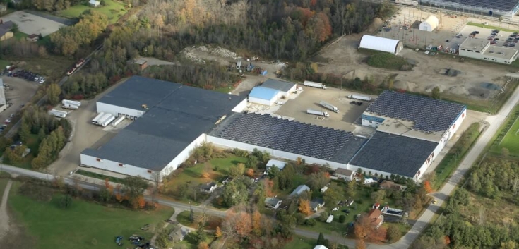 Exterior view of Ingersoll cold storage warehouse with Lineage logo