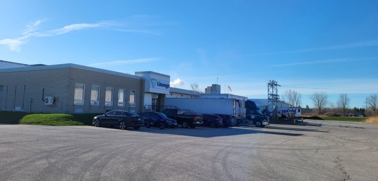 Exterior of Lineage London cold storage facility with loading docks and trucks
