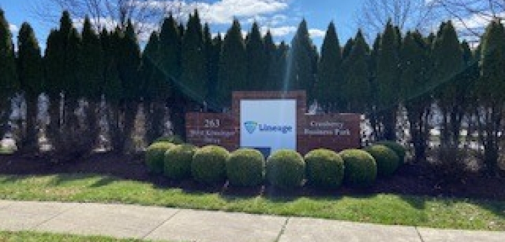 Exterior image Lineage sign behind bushes