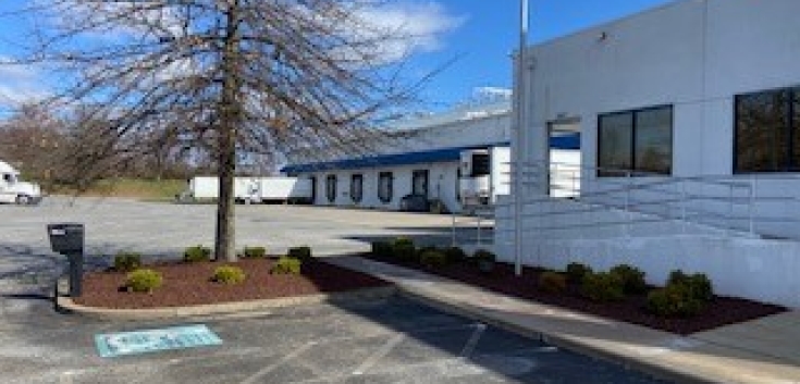 Exterior image of loading docks and parking lot