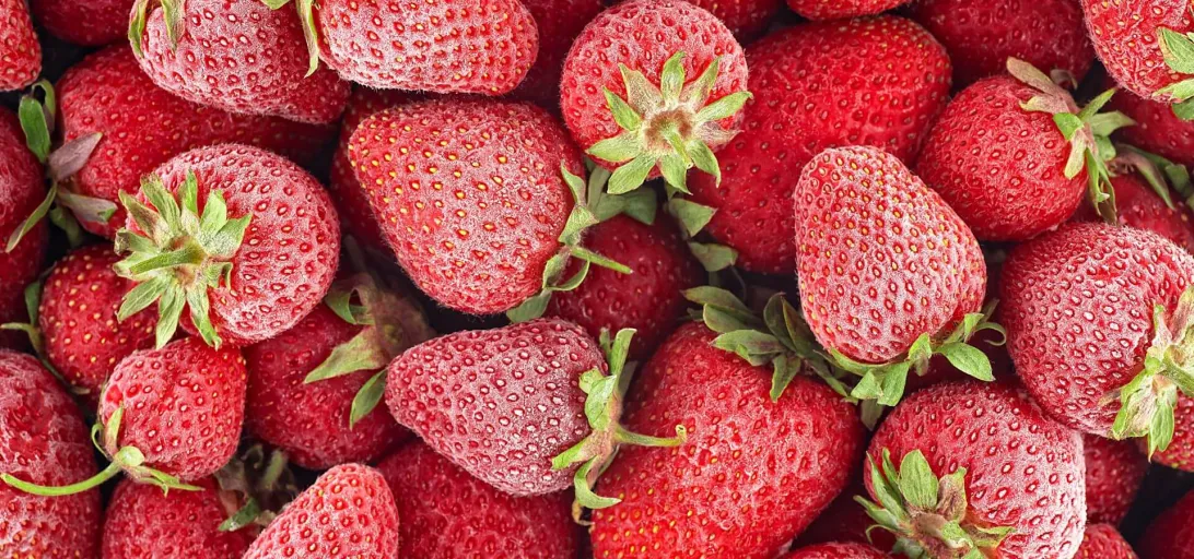 Close-up image of frozen strawberries, illustrating Lineage's temperature-controlled logistics capabilities in food donations.