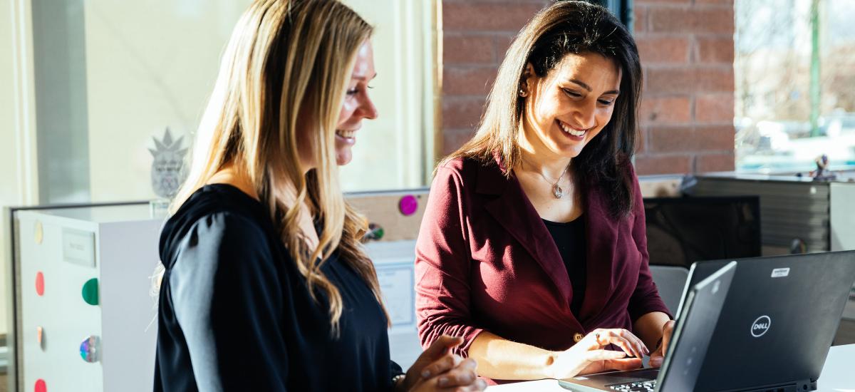 Women working together standup desks