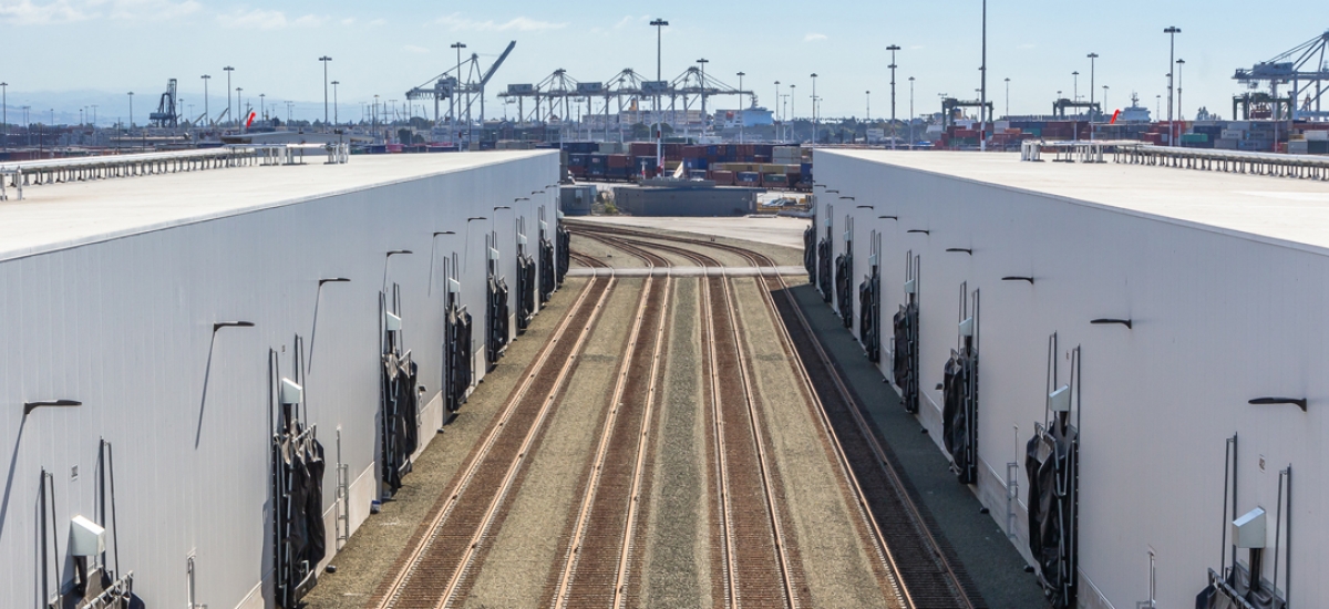 railroad tracks outside of a cold storage warehouse