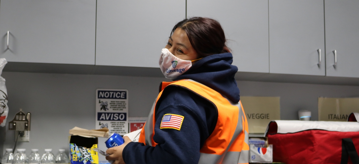 Worker in mask in break room