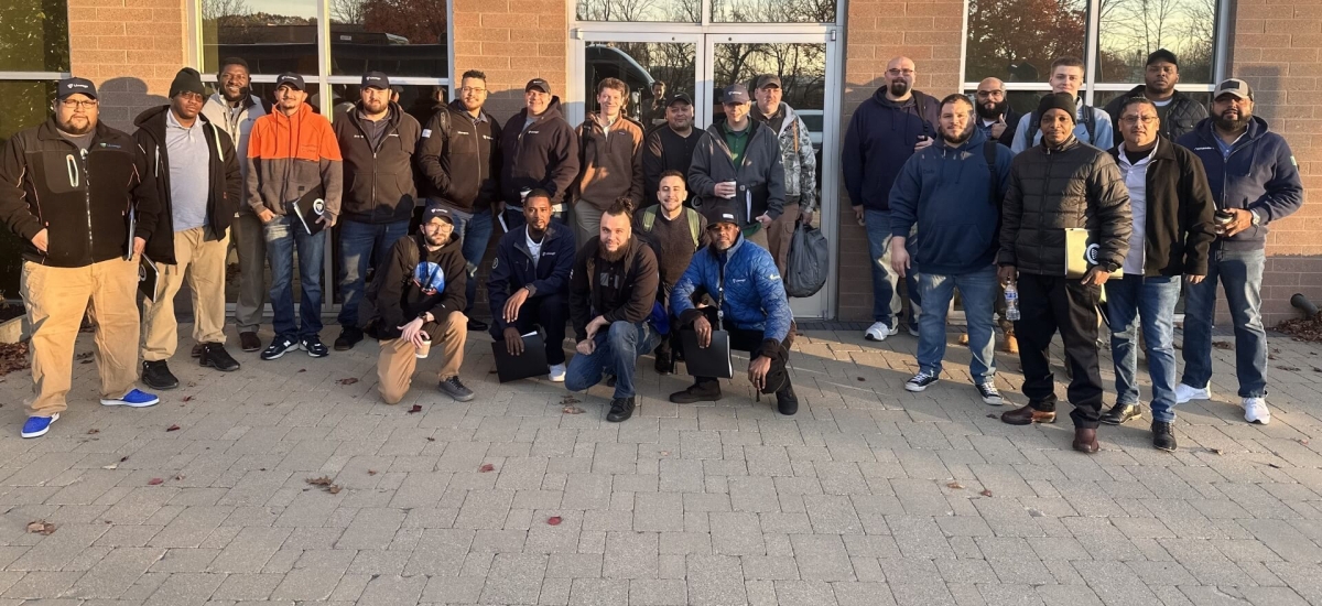 Group photo of Cohort 3 participants in the Lineage EDGE Program, gathered outdoors in front of a building, showcasing teamwork and leadership growth.