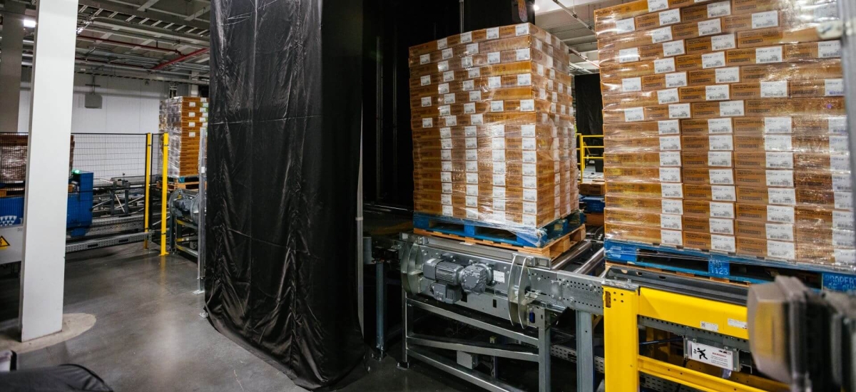 Pallets of products moving through the Lineage Eye system in a cold storage warehouse, using AI-powered computer vision to automate receiving and improve accuracy.