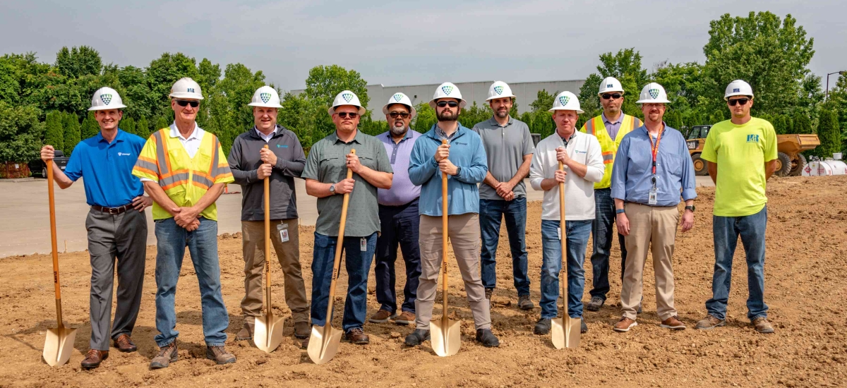 A group of people stand with shovels during a groundbreaking ceremony at a Lineage site in KY