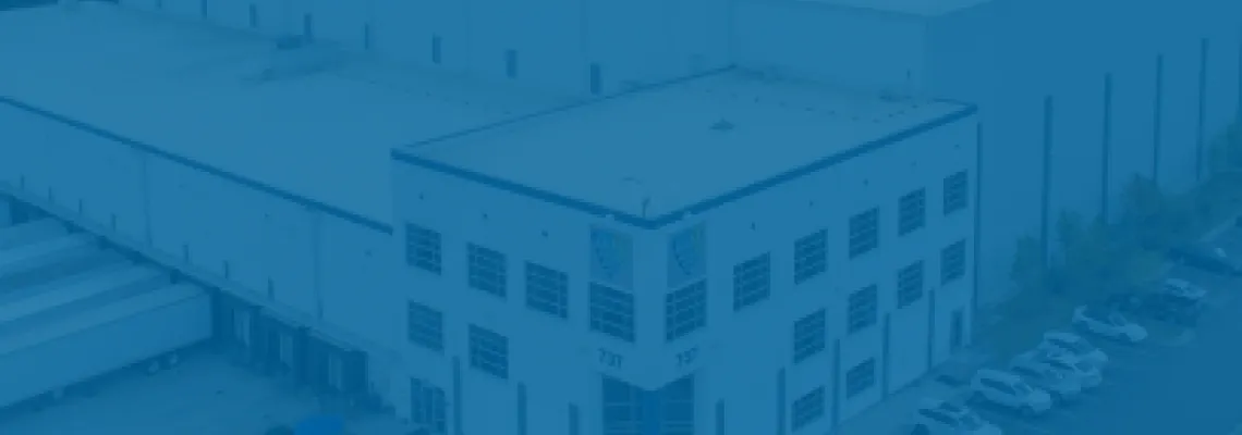 An aerial view of a Lineage cold storage facility with a blue semi-transparent overlay