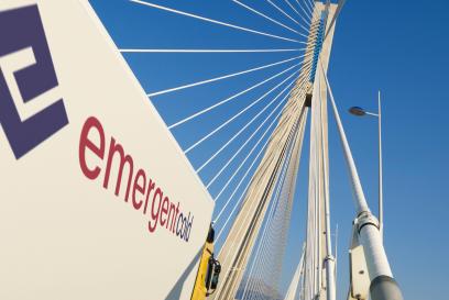 emergent cold logo on a truck going over a bridge