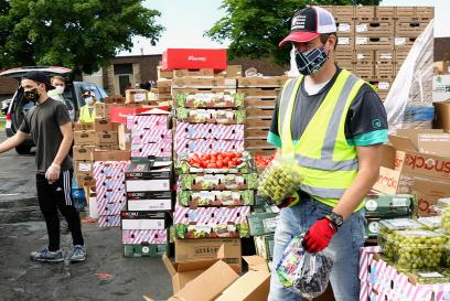 volunteers handing out food