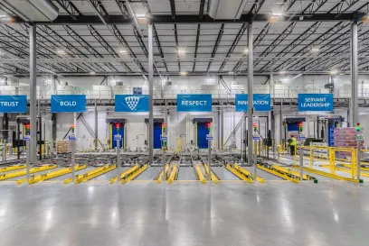 lineage's value flags hanging above automated warehouse