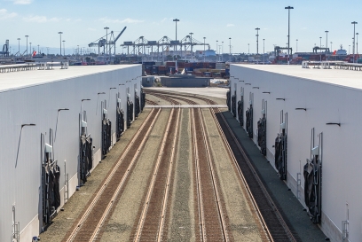 railroad tracks outside of a cold storage warehouse