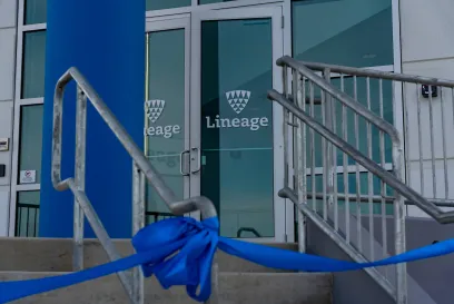 Entrance of Lineage’s new fully automated cold storage facility in Hazle Township, Pennsylvania, with a blue ribbon tied in front for the grand opening ceremony.