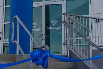 Entrance of Lineage’s new fully automated cold storage facility in Hazle Township, Pennsylvania, with a blue ribbon tied in front for the grand opening ceremony.