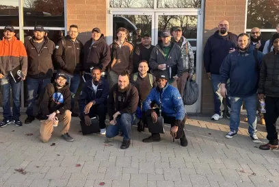 Group photo of Cohort 3 participants in the Lineage EDGE Program, gathered outdoors in front of a building, showcasing teamwork and leadership growth.