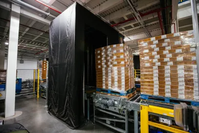 Pallets of products moving through the Lineage Eye system in a cold storage warehouse, using AI-powered computer vision to automate receiving and improve accuracy.