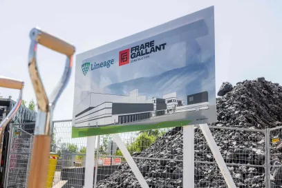 A sign announces a construction project of a Lineage warehouse by Frare Gallant in Canada