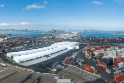Aerial view of Lineage’s cold storage facility at the Port of Oakland surrounded by shipping containers, representing bonded warehousing, imports and exports amid tariff trade routes.