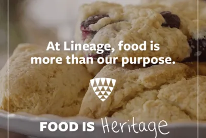 Scones on a plate featured in the Food Is Heritage campaign, with text emphasizing food as a source of tradition and meaning at Lineage.