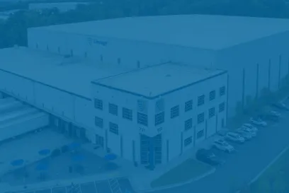 An aerial view of a Lineage cold storage facility with a blue semi-transparent overlay