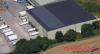 Aerial view of Lineage’s Belle Eau Park facility in Bilsthorpe, UK, featuring solar panels and Yearsley Logistics-branded trucks at the loading bays.