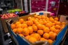 A large amount of oranges in a crate